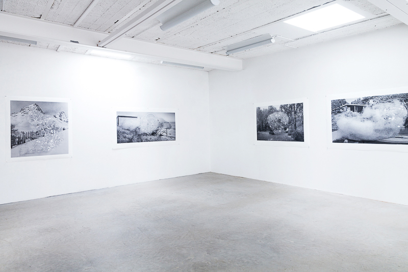 exhibition view with four printed black white photographies on the wall